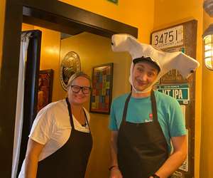 Photo of employees in Halloween costumes- Barb, Sean