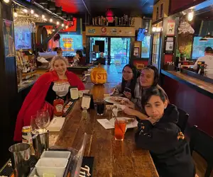 Photo of employees in Halloween costumes-  Sammy, Isa