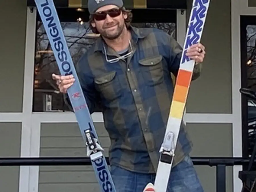 Photo of man holding skis for fundraiser 