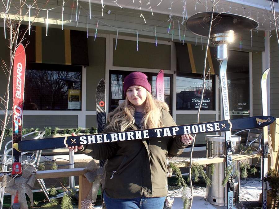 Photo of Sammy holding STH ski for fundraiser